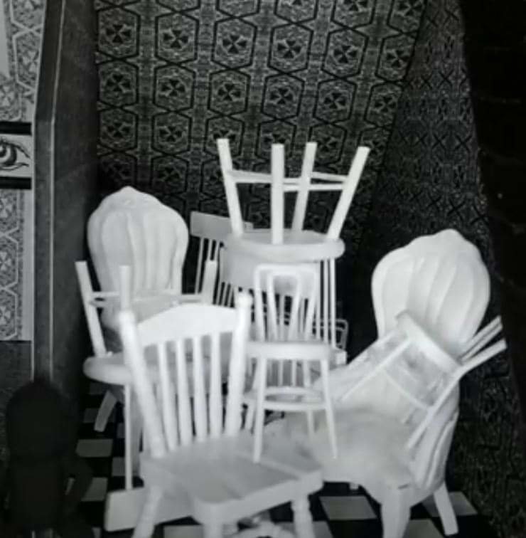 Chairs for an unwilling crowd go awry when collected in the small upper room of “The Witch’s House.”